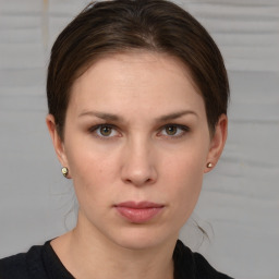 Neutral white young-adult female with short  brown hair and brown eyes