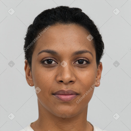 Joyful black young-adult female with short  black hair and brown eyes