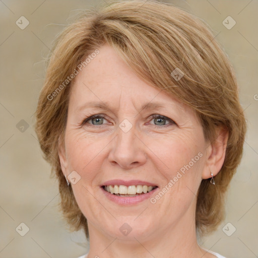 Joyful white adult female with medium  brown hair and blue eyes