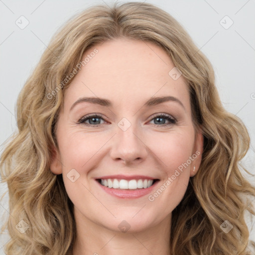 Joyful white young-adult female with long  brown hair and blue eyes