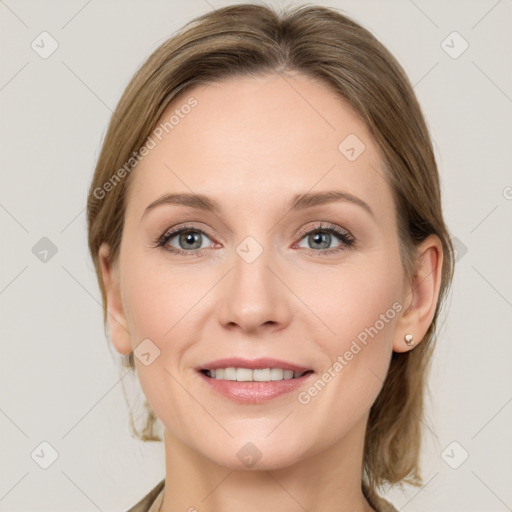 Joyful white young-adult female with medium  brown hair and grey eyes