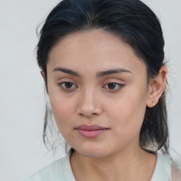 Joyful asian young-adult female with medium  brown hair and brown eyes