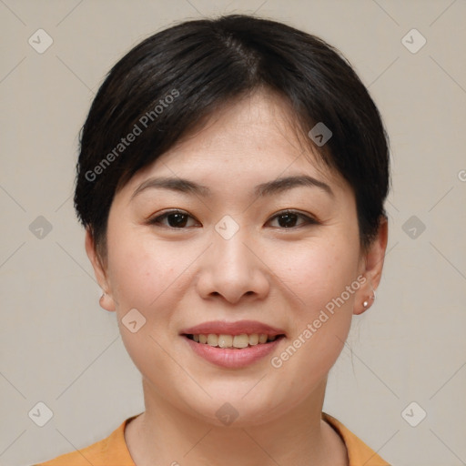 Joyful asian young-adult female with short  brown hair and brown eyes