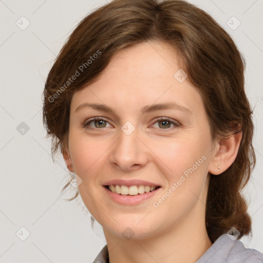 Joyful white young-adult female with medium  brown hair and green eyes