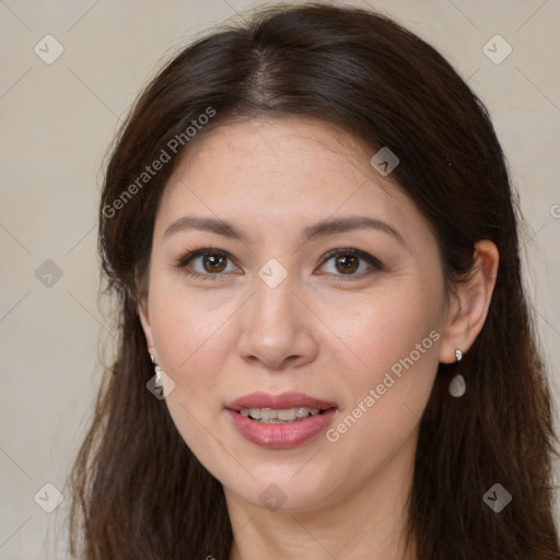 Joyful white adult female with long  brown hair and brown eyes