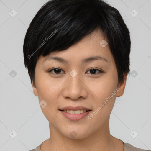 Joyful asian young-adult female with short  black hair and brown eyes