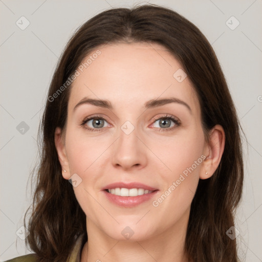 Joyful white young-adult female with medium  brown hair and green eyes