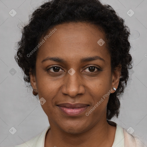 Joyful black adult female with short  brown hair and brown eyes