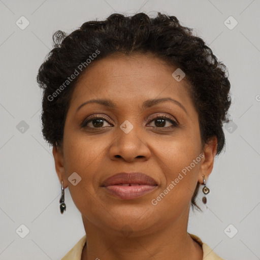 Joyful black adult female with short  brown hair and brown eyes