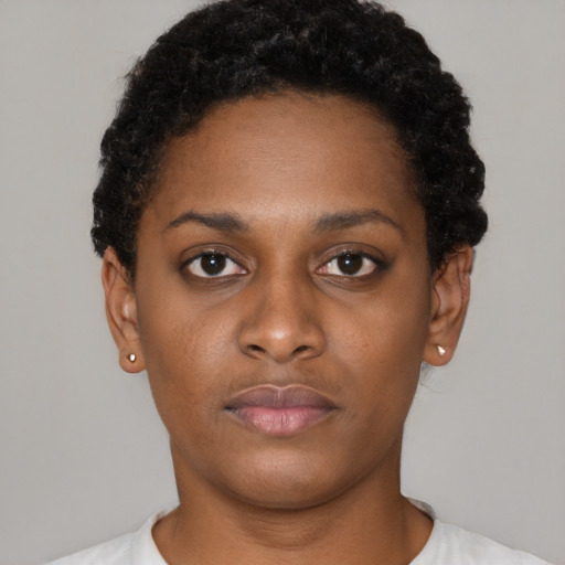 Neutral black young-adult female with short  black hair and brown eyes