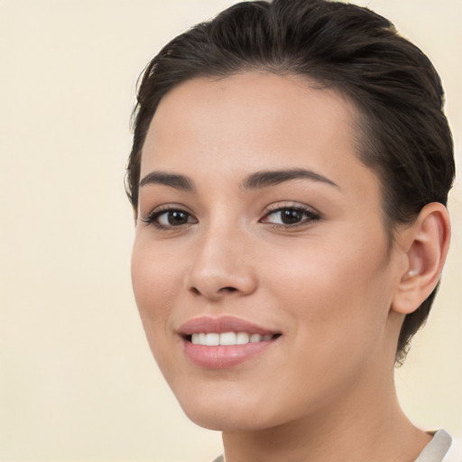 Joyful white young-adult female with short  brown hair and brown eyes