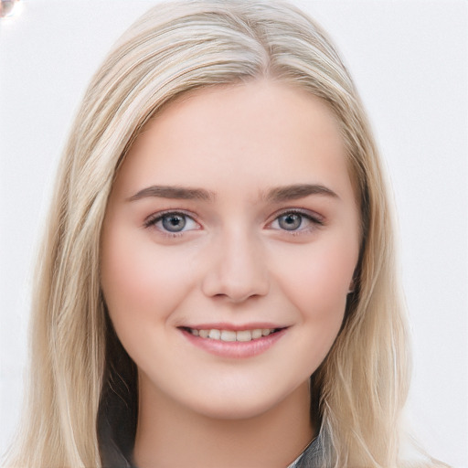 Joyful white young-adult female with long  brown hair and blue eyes