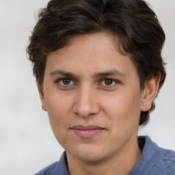 Joyful white adult male with medium  brown hair and brown eyes