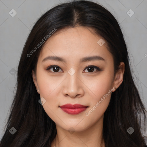 Joyful asian young-adult female with long  brown hair and brown eyes