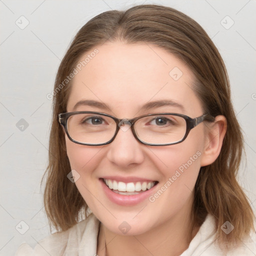 Joyful white young-adult female with medium  brown hair and blue eyes