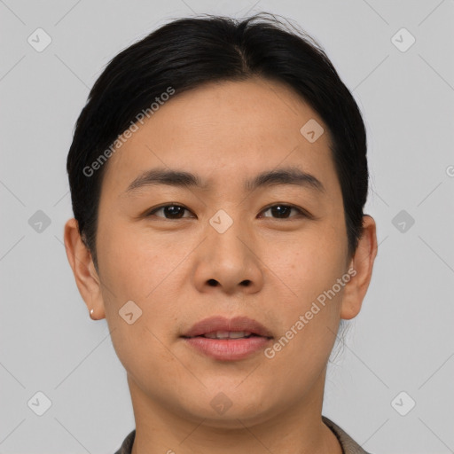 Joyful asian young-adult male with short  black hair and brown eyes