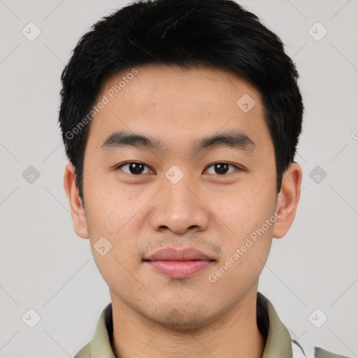 Joyful asian young-adult male with short  black hair and brown eyes