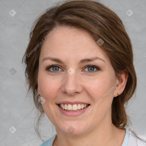 Joyful white young-adult female with medium  brown hair and blue eyes