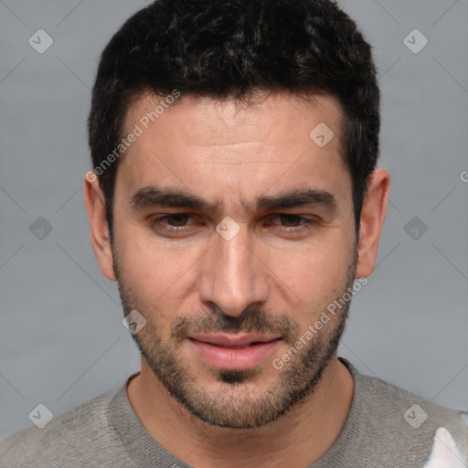 Joyful white adult male with short  black hair and brown eyes