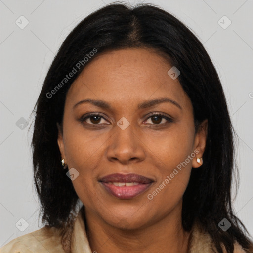 Joyful black adult female with long  brown hair and brown eyes