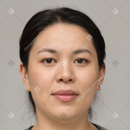 Joyful asian young-adult female with medium  black hair and brown eyes