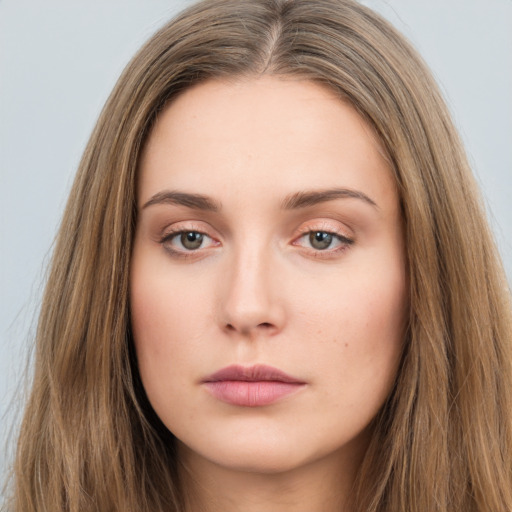 Neutral white young-adult female with long  brown hair and brown eyes