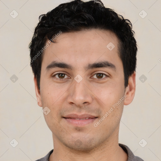 Joyful white young-adult male with short  black hair and brown eyes