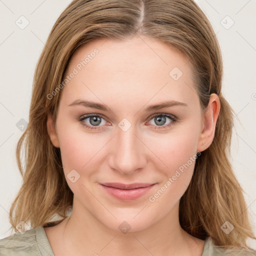 Joyful white young-adult female with medium  brown hair and blue eyes