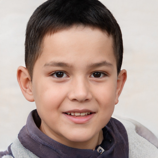 Joyful white child male with short  brown hair and brown eyes