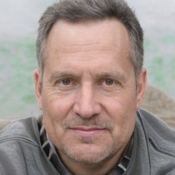 Joyful white middle-aged male with short  brown hair and brown eyes