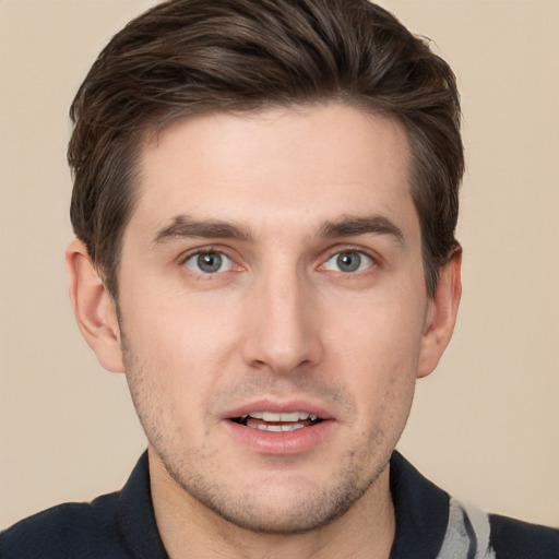 Joyful white young-adult male with short  brown hair and brown eyes