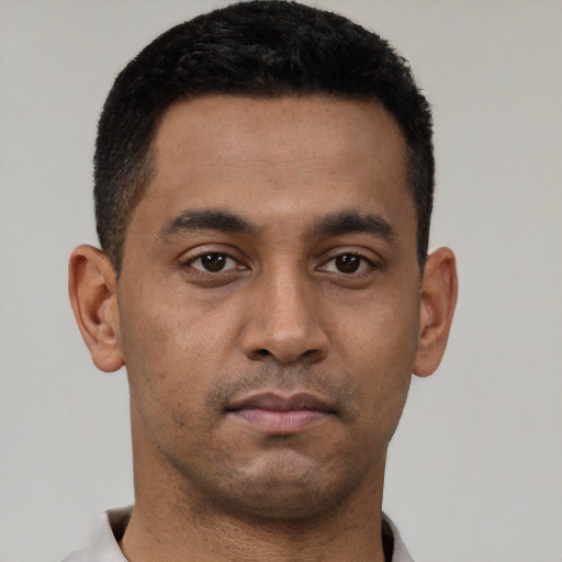 Neutral latino young-adult male with short  brown hair and brown eyes