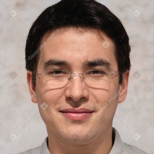 Joyful white adult male with short  black hair and brown eyes