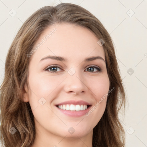 Joyful white young-adult female with long  brown hair and green eyes