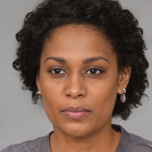 Neutral black young-adult female with medium  black hair and brown eyes