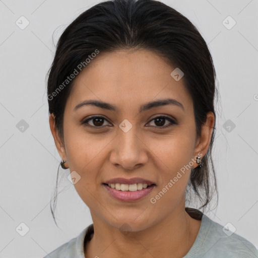 Joyful latino young-adult female with medium  brown hair and brown eyes