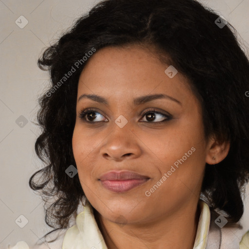 Joyful black young-adult female with long  black hair and brown eyes