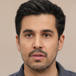 Neutral white young-adult male with short  black hair and brown eyes