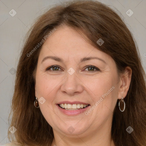 Joyful white adult female with long  brown hair and brown eyes