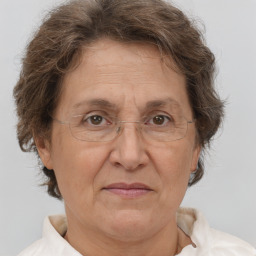Joyful white middle-aged female with short  brown hair and brown eyes