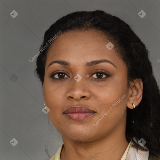 Joyful black young-adult female with long  brown hair and brown eyes