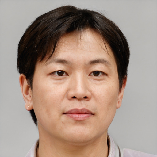 Neutral asian adult male with short  brown hair and brown eyes