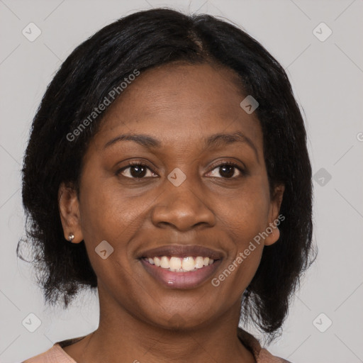 Joyful black young-adult female with medium  brown hair and brown eyes