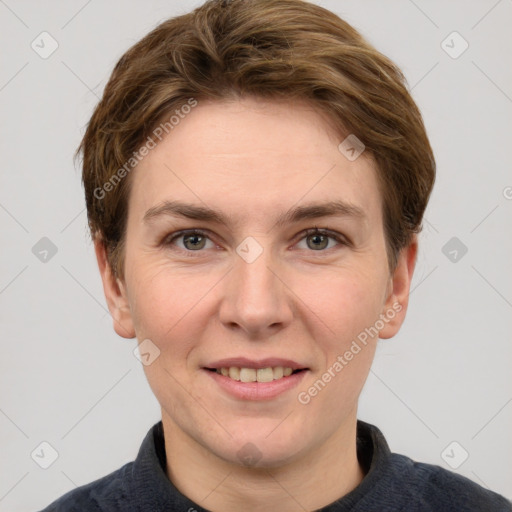 Joyful white young-adult female with short  brown hair and grey eyes