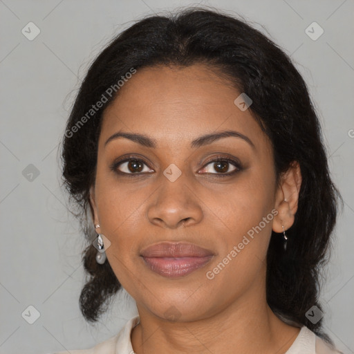 Joyful black adult female with medium  brown hair and brown eyes