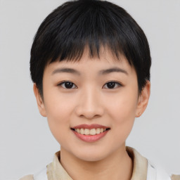 Joyful asian young-adult female with short  black hair and brown eyes