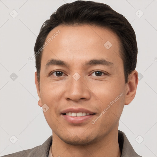 Joyful white young-adult male with short  brown hair and brown eyes