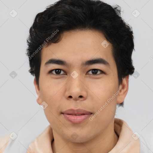 Joyful latino young-adult male with short  brown hair and brown eyes