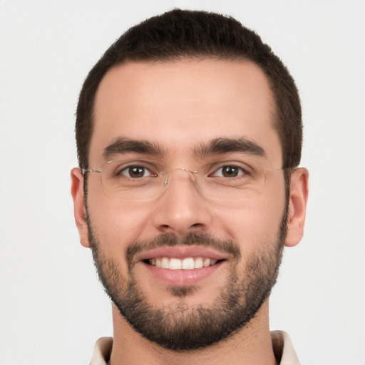 Joyful white young-adult male with short  brown hair and brown eyes