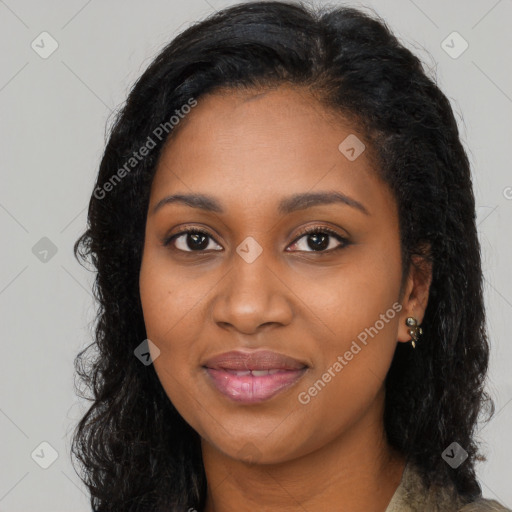 Joyful black young-adult female with long  black hair and brown eyes